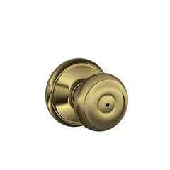 Schlage Residential F40GEO609 Georgian Knob Privacy Lock with 16080 Latch and 10027 Strike Antique Brass Finish